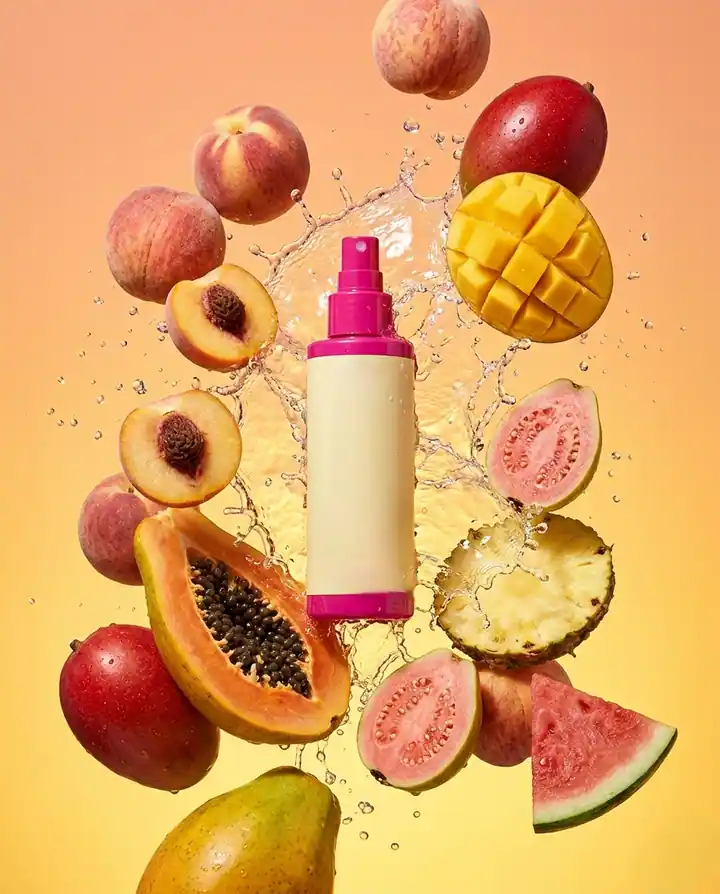 Papaya serum product photography with glossy skincare texture and fruit cues