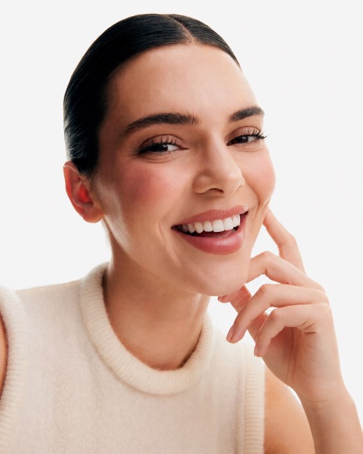 Same model smiling in a beauty-style emotion result preview
